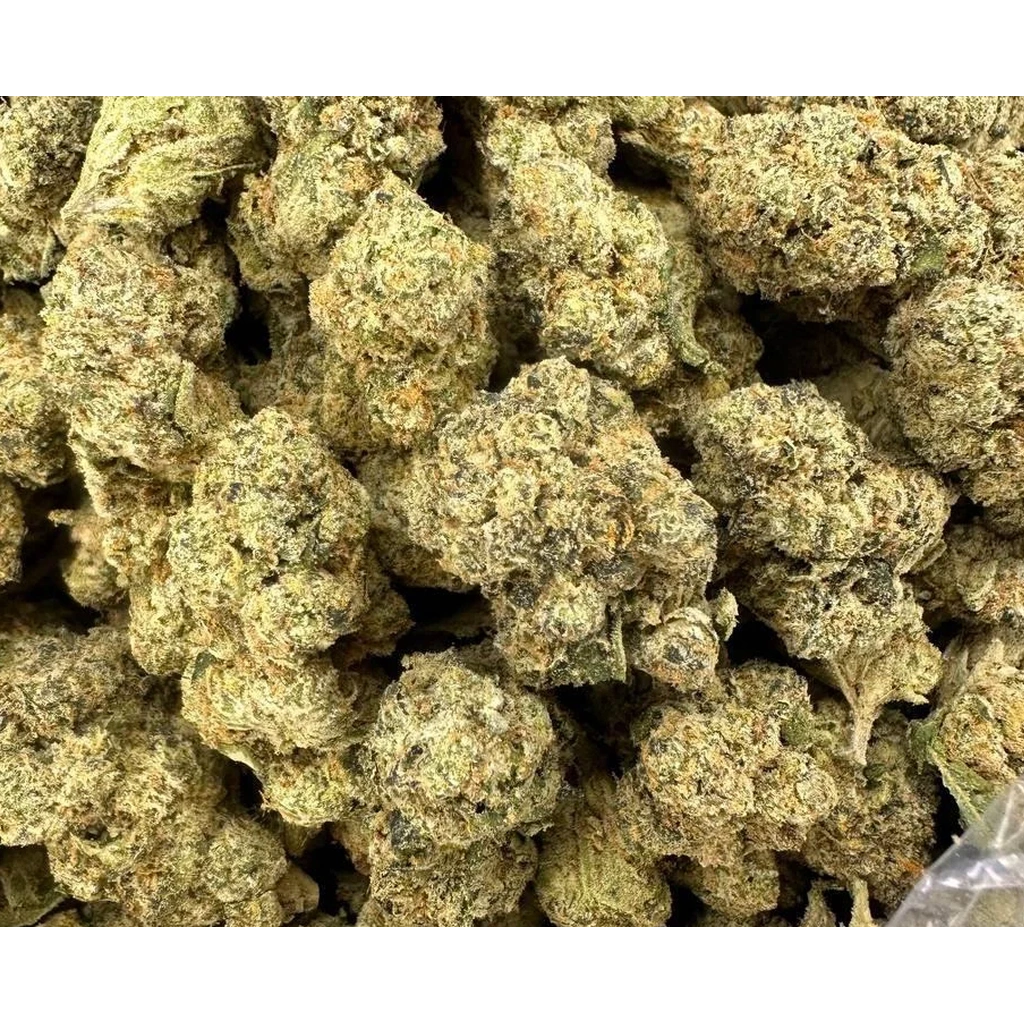 Bubble Bath THCa Flower buds featuring frosty trichomes, dense green nugs, and a creamy floral aroma with earthy undertones.
