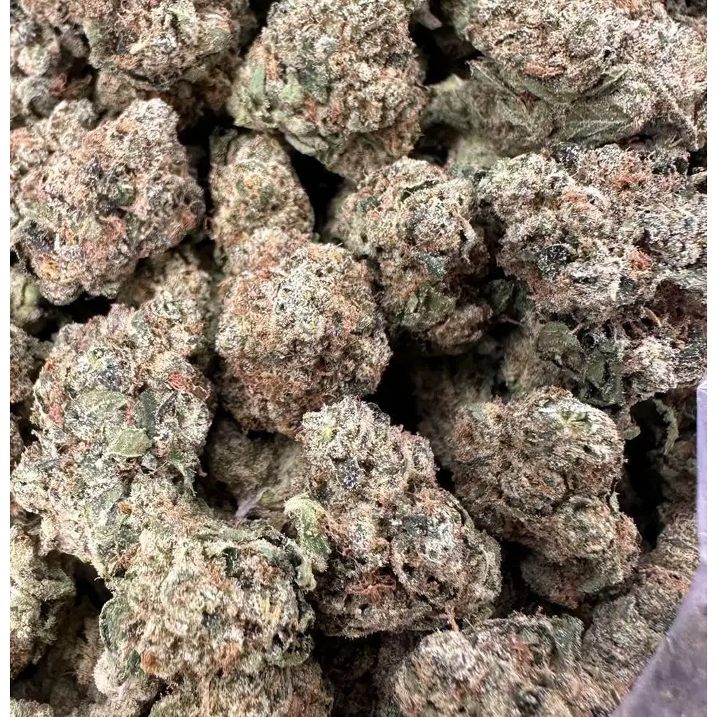Caked Up Candy THCa Flower buds featuring frosty trichomes, dense green nugs, and a sweet candy-inspired aroma profile.