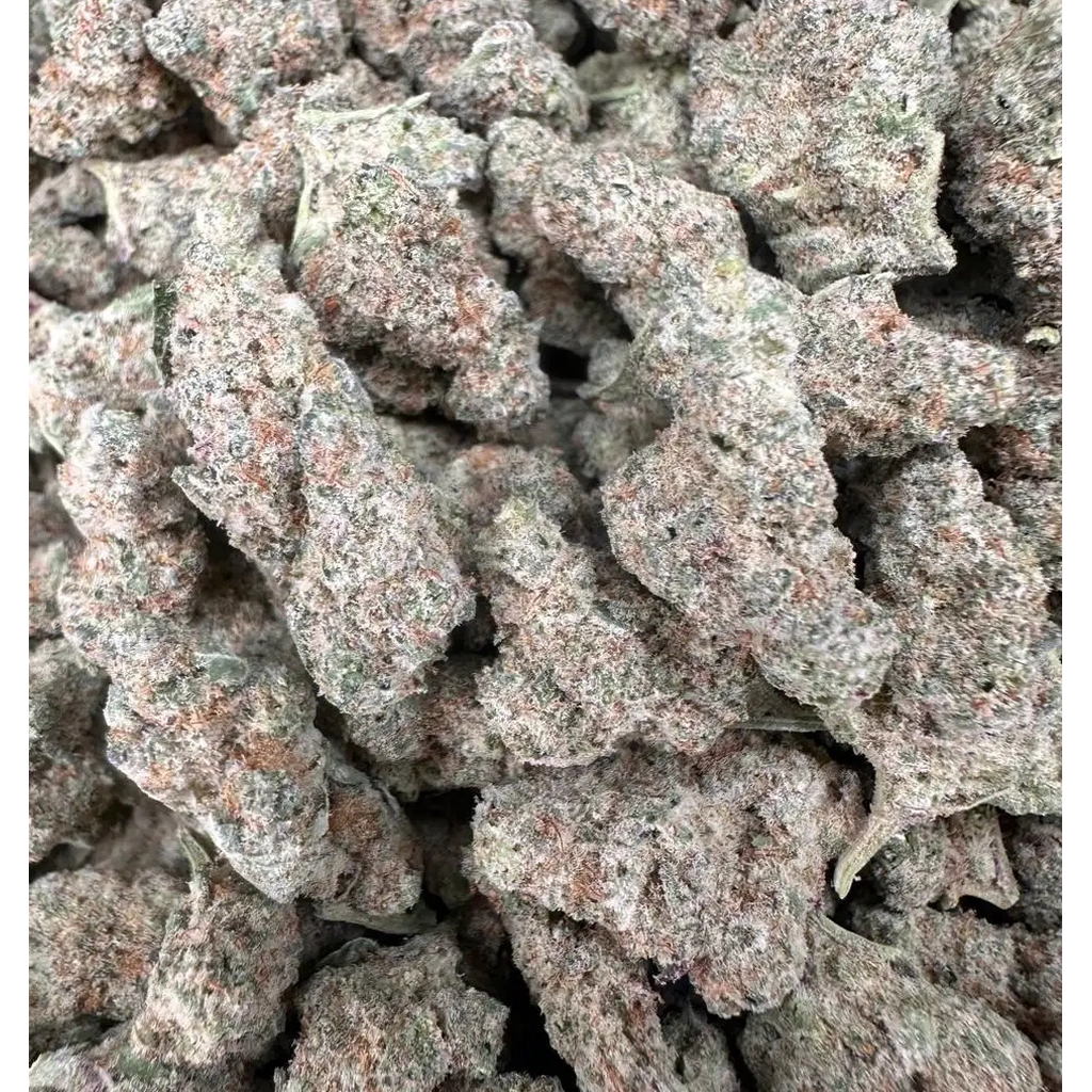 MAC 1 THCa Flower buds featuring dense green nugs, frosty trichomes, and an earthy citrus aroma profile.